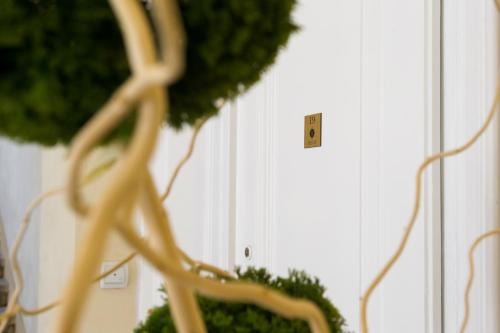 a close up of a light switch on a wall at Apartment HYGGE in Subotica