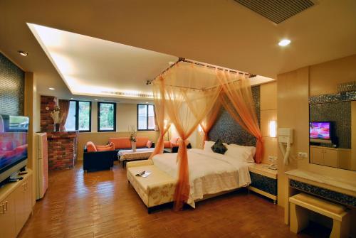 Katil atau katil-katil dalam bilik di Ming Lu Holiday Hotel