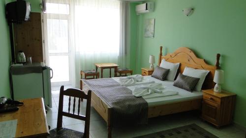 Ліжко або ліжка в номері Stemak Hotel
