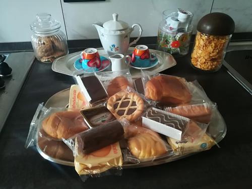 a tray of different types of food on a table at San Donato 40 in Bologna
