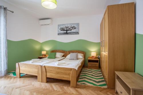 Ліжко або ліжка в номері Guesthouse Maver