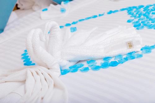 a close up of a white towel on a bed at Eden Vale Hotel in Ajiringano