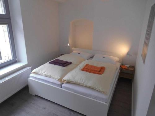 Ένα ή περισσότερα κρεβάτια σε δωμάτιο στο Ferienwohnungen Rheine Markt 12