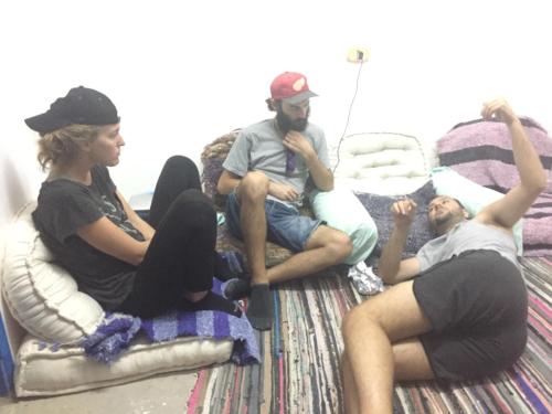 a group of people sitting on a couch at david hostel in Aswan