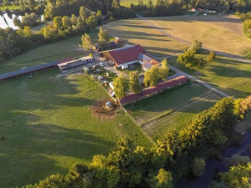 an aerial view of a house in a field with a train at FeWo Oberle in Ottenheim