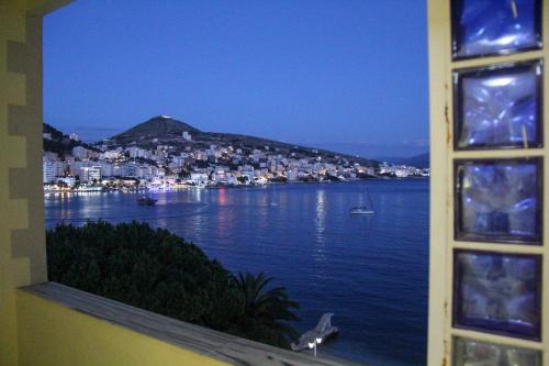 a window with a view of a body of water at Republika Hotel in Sarandë