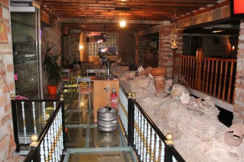a room with a bar and a counter in a building at Republika Hotel in Sarandë