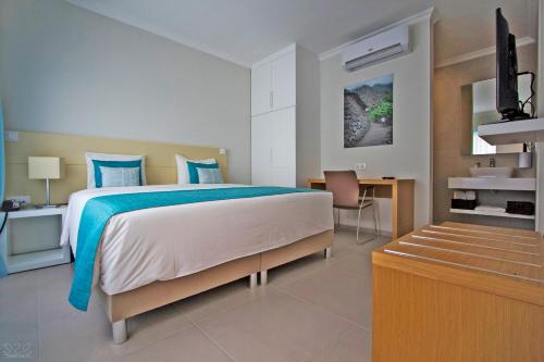 Postel nebo postele na pokoji v ubytování Tiduca Hotel