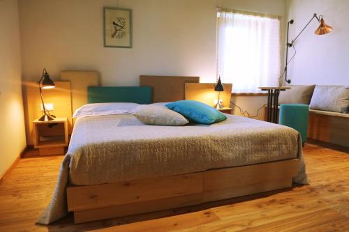 a bedroom with a bed with two pillows on it at Mostofiore in Conegliano