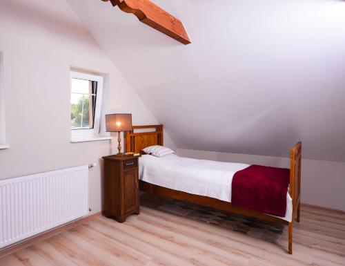 Łóżko lub łóżka w pokoju w obiekcie Apartament Topczewo