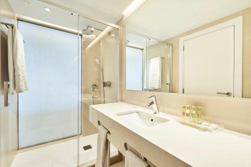 a bathroom with a sink and a shower at Eurostars Ibiza in Ibiza Town