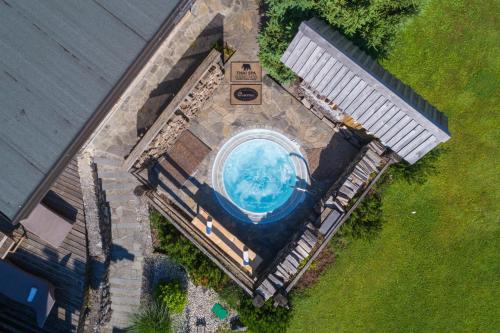 an overhead view of a swimming pool in a house at Apartment Wellness Essense in Bled