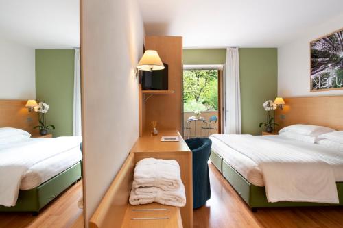 Postel nebo postele na pokoji v ubytování Vital Hotel Flora