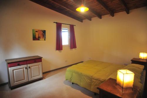 En eller flere senge i et værelse på Mahatma Villa Giardino