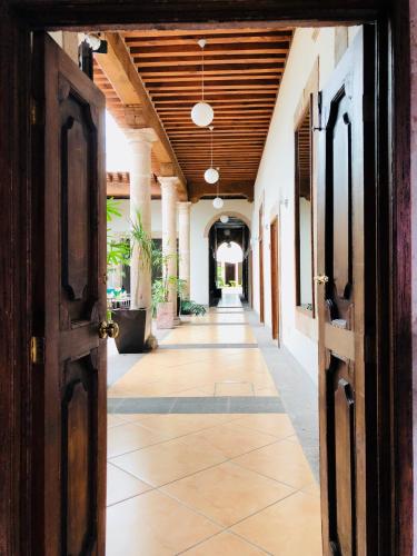an open door to a hallway in a building at Hotel Expres By Hosting House in Morelia