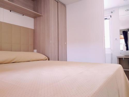 a bedroom with two beds and a window at Villaggio Dei Fiori in Sanremo
