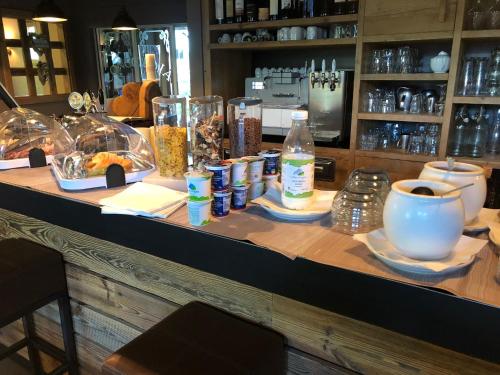 a counter with food and drinks on it at La Tresenda Hotel and Mountain Farm in Livigno