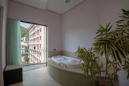 Una cama o camas en una habitación de Hotel Guarany