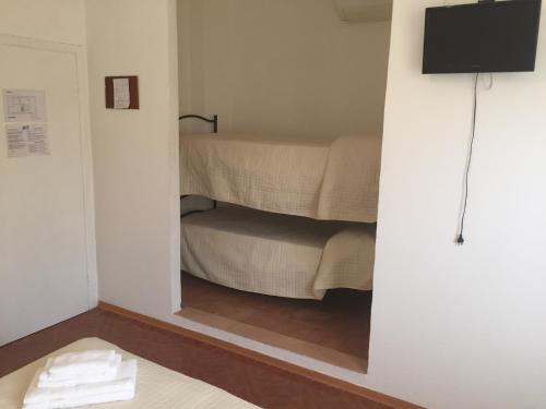 En eller flere senge i et værelse på Hotel Rimini