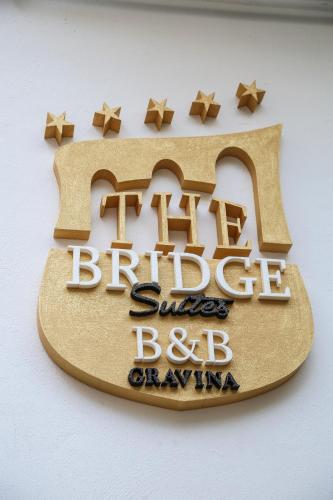 a sign for the british superstore bdsayarmaarmaarmaarma at The Bridge Suites in Gravina in Puglia