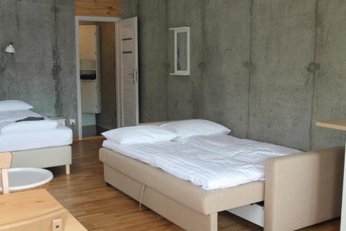 Cama o camas de una habitación en Lækjarhus Farm Holidays