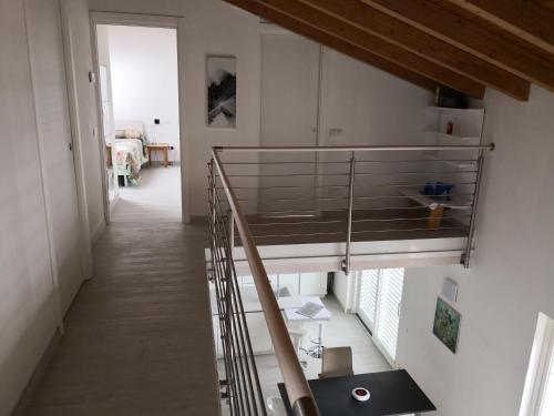 a room with a bunk bed and a staircase at Charme Lake Loft in Ispra