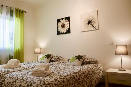 Ένα ή περισσότερα κρεβάτια σε δωμάτιο στο Algarve Sweet Home - Sea View