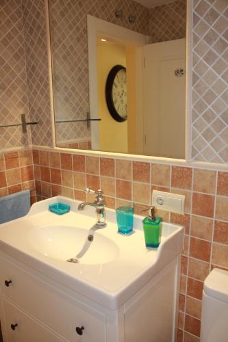 a bathroom with a sink and a mirror at Casa Santiago in Comillas