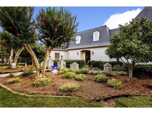 a house with a garden in front of it at Matthews Manor Bed & Breakfast in Charlotte