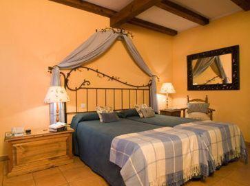 A bed or beds in a room at La Casita de Cabrejas