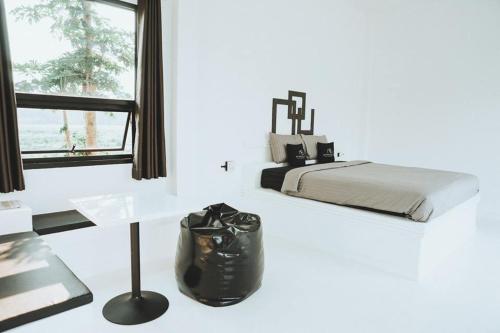 Ένα ή περισσότερα κρεβάτια σε δωμάτιο στο Aether Pai Villa