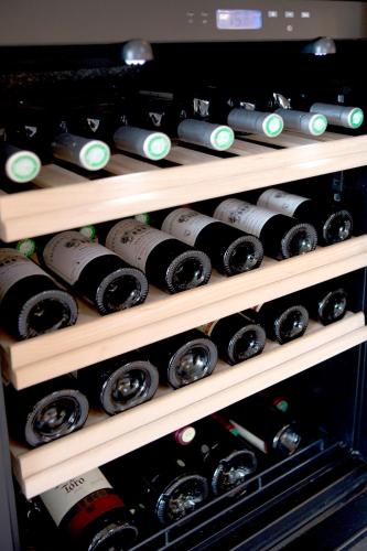 a bunch of wine bottles in a wine cellar at Kyriad Limoges Sud - Feytiat in Feytiat