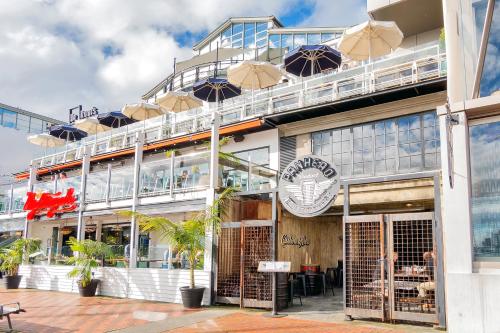 a building with umbrellas on top of it at Princes Wharf Boutique Apartments in Auckland