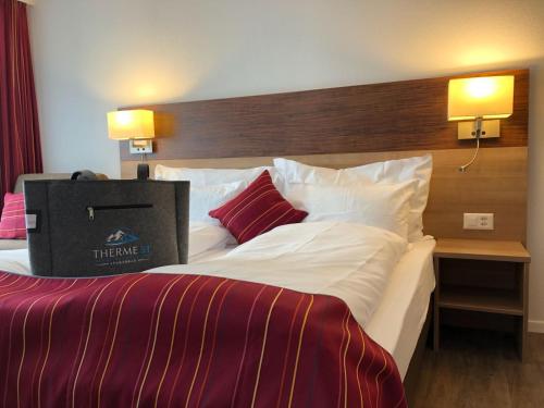 a large bed with a box on top of it at Therme 51° Hotel Physio & Spa in Leukerbad