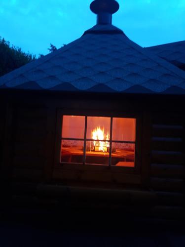 a fire burns in a window of a house at Ferienanlage Beatrix in Stegersbach