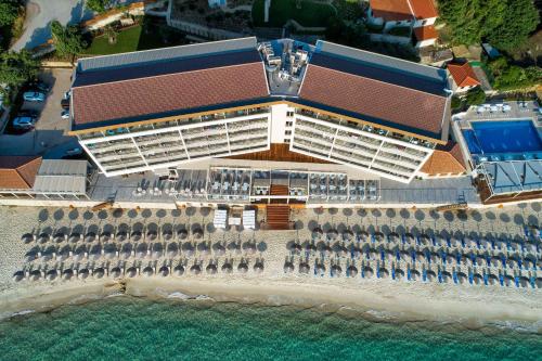 an overhead view of a building on the beach at Ammon Zeus Luxury Beach Hotel in Kallithea Halkidikis