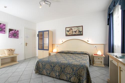 Postel nebo postele na pokoji v ubytování Hotel Elpiro