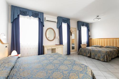 Postel nebo postele na pokoji v ubytování Hotel Elpiro