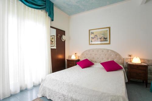 Postel nebo postele na pokoji v ubytování Hotel Elpiro