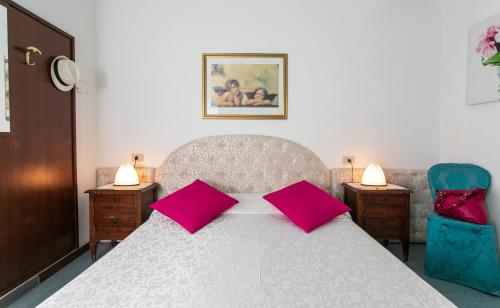 Postel nebo postele na pokoji v ubytování Hotel Elpiro