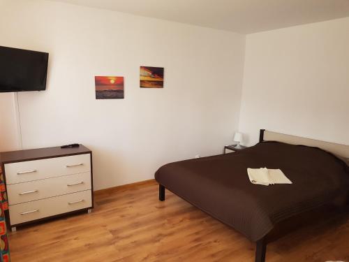 Posteľ alebo postele v izbe v ubytovaní Apartamenty Nadmorskie