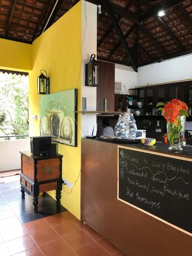 a kitchen with a counter and a counter top at Blue Pillars Kandy in Kandy