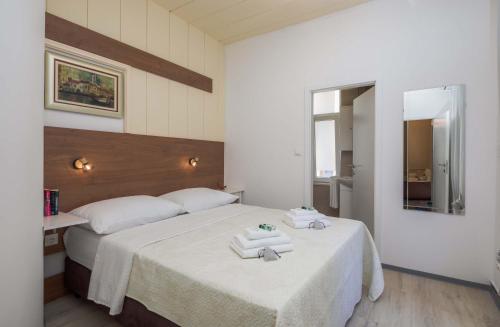 a bedroom with two beds with towels on them at PLR-Royal luxury apartment in Split