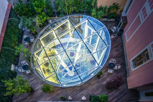 an overhead view of a glass building with a table at Ibis Styles Milano Centro in Milan