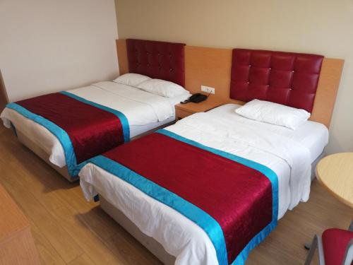 Postel nebo postele na pokoji v ubytování Bursa şahin hotel