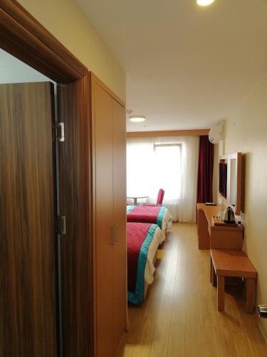 Postel nebo postele na pokoji v ubytování Bursa şahin hotel