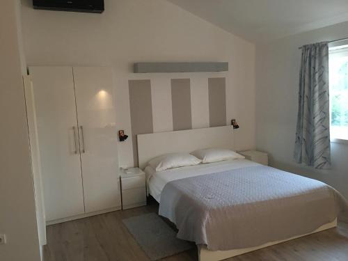 Postel nebo postele na pokoji v ubytování Studio apartman Dado