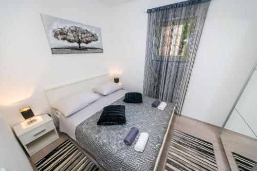 Katil atau katil-katil dalam bilik di Apartman Nino