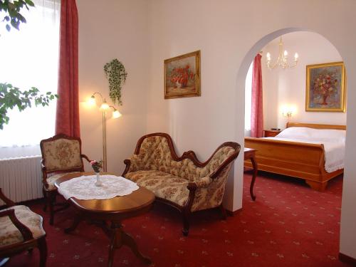 Postel nebo postele na pokoji v ubytování Hotel Opera