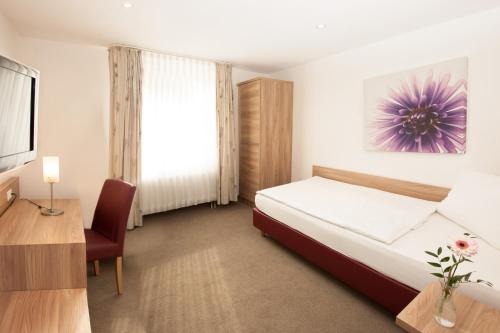 Postel nebo postele na pokoji v ubytování Hotel Schützenburg